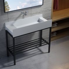 a white sink sitting under a mirror in a bathroom