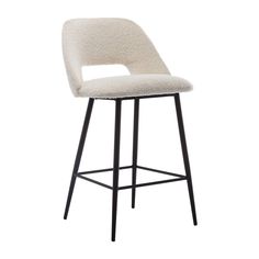 an upholstered bar stool with a black metal frame and white sheepskin seat