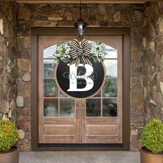 the front door is decorated with wreaths and flowers