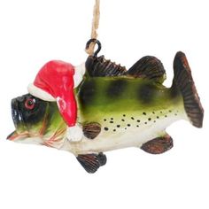 a ceramic fish ornament with a santa hat on it's head hanging from a rope