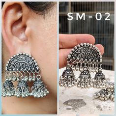 Add charm and charisma to your beautiful personality with these exquisitely designed and handcrafted high quality German Silver earrings in antique look. Pair them up with any formal or semi formal attire and gather compliments wherever you go. Suitable for both casual and dressy occasions. Note: All in stock items will be shipped from New Delhi, India within 2-3 business days after receipt of payment. International orders may take anytime between 3 to 5weeks for your shipments to reach you. som Oxidized Brass Jhumkas, Silver Chandbali Jhumkas In Brass, Dual-tone Metal Jhumkas In Temple Jewelry Style, Oxidized Brass Chandbali Danglers, Traditional Silver Brass Jhumkas, Dual-tone Metal Jhumkas Temple Jewelry, Silver Brass Jhumkas, Festive Oxidized Brass Jhumkas, Temple Jewelry Brass Danglers With Oxidized Finish