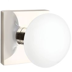 a white light that is on the side of a wall or ceiling mounted fixture with a round glass ball at the top