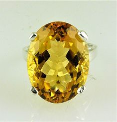 ALL OUR GEMSTONES ARE NATURAL NOT LAB CREATED ALL OUR JEWELRY IS HANDCRAFTED IN THE U.S.A. This fine quality richly colored Bolivian Citrine with a wonderful golden -yellow hue set in a bold, traditional design. This is a comfortable solitaire ring can be made of solid 925 sterling silver or gold, 10kt or 14kt. This is a great everyday ring that you'll wear everywhere, from the grocery to date night. makes a perfect gift. Citrine is the Birthstone for November. Citrine 20X15 MM oval - 18.55 Cara Formal Oval Yellow Topaz Ring, Formal Yellow Oval Topaz Ring, Oval Topaz Ring For Formal Occasions, Fine Jewelry Yellow Oval Topaz Ring, Classic Oval Citrine Rings, Yellow Oval Topaz Ring Hallmarked, Elegant Oval Yellow Gemstones, Oval Faceted Topaz Anniversary Ring, Classic Yellow Oval Topaz Ring