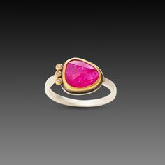 A juicy pink, rose cut ruby is wrapped in warm 22k gold accented with three sparkling diamonds on the side. This ring would make a stunning alternative engagement ring, or a special addition to your jewelry collection. Sterling silver back and 2mm hammered band. The center stone measures approximately 3/8 inch x 1/2 inch. Matte finish. Anniversary Rings With Rose Cut Pink Sapphire, Fine Jewelry Pink Ruby Ring With Single Cut Diamonds, Yellow Gold Rings With Pink Sapphire And Gemstone Accents, Pink Ruby Ring With Single Cut Diamonds, Anniversary Jewelry With Rose Cut Diamonds And Pink Sapphire, Pink Ruby Ring With Single Cut Diamonds For Anniversary, Pink Ruby Ring With Rose Cut Diamonds, Yellow Gold Pink Sapphire Rings With Single Cut Diamonds, Yellow Gold Tourmaline Rings With Rose Cut Diamonds