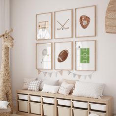 a child's room with pictures on the wall and toy storage bins below