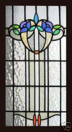 a stained glass window with flowers on it