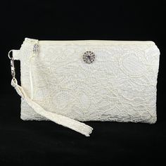 Bridal Ivory Wristlet Purse for the bride to be.  Designed to hold your essentials, this wristlet is small enough to carry easily, but big enough for all your needs!   This purse is made in Ivory Lace, and is suitable for a wedding, as a clutch for the bride, bridesmaid, or use with an evening formal.   Can also be used as a Makeup Bag, Phone Holder, or a Gift For The Bride. *Please note the Wristlet you receive will vary from the one pictured due to the cut of the fabric. The features of this w Cheap Trendy Evening Wristlet, Cheap White Wristlet For Gift, Affordable Trendy Wristlet For Parties, Chic Cheap White Wristlet, Cheap White Wristlet As A Gift, Cheap Trendy Wristlet For Party, Affordable Silver Elegant Wristlet, Cheap Women's White Wristlet, Cheap Elegant Wristlet With Removable Pouch