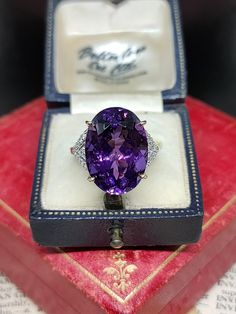 Here we have an incredible statement cocktail ring featuring sparkling natural gemstones with a central very large purple amethyst and diamond assets in a unique art deco inspired design. The ring is fashioned from 9ct yellow gold Birmingham Hallmarked. UK size - O US size - 7.25  Amethyst length approx - 17.9mm Message me any questions  ITEM - S2276 Luxury Classic Amethyst Ring With Prong Setting, Luxury Elegant Amethyst Ring With Round Band, Luxury Vintage Amethyst Ring For Anniversary, Luxury Purple Crystal Oval Ring, Luxury Octagon Amethyst Ring For Anniversary, Luxury Formal Amethyst Ring Oval Cabochon, Etsy Gold Ring, Art Deco Inspired, Yellow Gold Ring