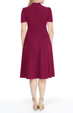 This dainty short sleeve dress is a retro inspired staple that's perfect for any well-dressed occasion. 45" length Necktie Short sleeves Back zip closure Lined 96% polyester, 4% spandex Hand wash, dry flat Imported Model Stats: 5'10" height; 34" bust; 27" waist; 35" hips. Elegant Cap Sleeve Dress With Back Zipper, Fitted Dress With Back Zipper And Short Sleeves, Classic Knee-length Dress With Back Zipper, Formal Short Sleeve Midi Dress With Flattering Silhouette, Formal Midi Dress With Flattering Silhouette And Short Sleeves, Party Dress With Back Zipper And Short Sleeves, Short Sleeve Fit And Flare Midi Dress For Work, Fit And Flare Short Sleeve Work Dresses, Fit And Flare Short Sleeve Dress For Workwear