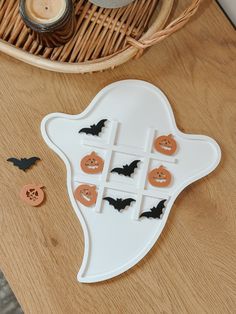 a wooden table topped with lots of halloween decorations