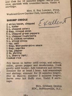 an old recipe for shrimp criole on a table