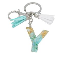 the letter y is made out of glass and has tassels