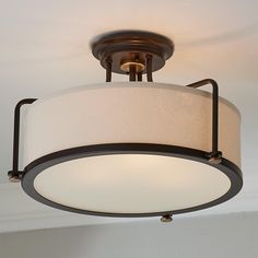 a light fixture hanging from the ceiling in a room