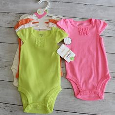 New With Tags Carter's Bodysuit Set Baby Girl Size 3 Months This Bodysuit Set Includes Five One-Piece Summer Tops With Cap Sleeves. One Is Solid Bright Pink With Ruffles, One Is Solid Lime Green With Ruffles, One Is Solid Pale Orange, One Is White With Lime Butterflies And One Is White With Pink Butterflies. They Are New With Tags. Hanger Included. 100% Cotton Spring Playtime Onesie In Solid Color, Spring Playtime Solid Onesie, Spring Playtime Solid Color Onesie, Spring Playtime Plain Onesie, Pink Playful Short Sleeve Bodysuit For Spring, Playful Pink Short Sleeve Bodysuit For Spring, Playful Pink Short Sleeve Bodysuit, Pink Short Sleeve Bodysuit For Playtime In Spring, Cute Pink Short Sleeve Bodysuit For Spring