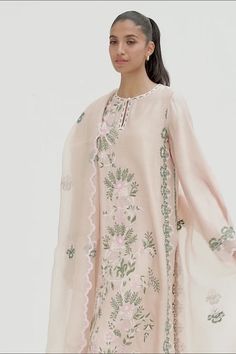 This timeless long shirt silhouette is cut from khaddi silk and is rendered with our signature floral embroidery. An organza dupatta with worked borders and rawsilk trousers complement the look. Spring Kurta With Sheer Dupatta In Chanderi, Spring Chanderi Kurta With Sheer Dupatta, Eid Floral Embroidery Organza Palazzo Set, Eid Floral Embroidered Organza Palazzo Set, Spring Silk Palazzo Set With Sheer Dupatta, Spring Cotton Silk Unstitched Suit With Resham Embroidery, Spring Silk Unstitched Suit With Resham Embroidery, Designer Spring Kurta With Sheer Dupatta, Spring Cotton Silk Dupatta With Resham Embroidery