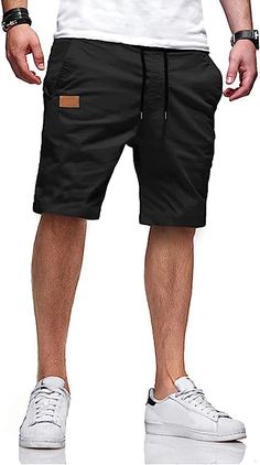 Stay comfortable and stylish with our Casual Summer Drawstring Closure Beach Shorts. Crafted from a high-quality blend of cotton and elastane, these shorts are lightweight, breathable, and perfect for warm weather. They feature a convenient drawstring closure and are easy to care for with a hand wash. With 2 side pockets and 2 reinforced back pockets, you can confidently carry your essentials wherever you go. Features: 98% Cotton, 2% Elastane Drawstring closure Hand Wash Only Quality Fabric: 98% Casual Shorts For Beach Season, Casual Shorts For Beach Season Leisure, Casual Beach Season Leisure Shorts, Casual Cotton Shorts For Vacation, Casual Cotton Shorts For Beach Season, Casual Vacation Bottoms With Drawstring, Beach Cotton Shorts With Drawstring, Cotton Beach Shorts With Drawstring, Casual Drawstring Shorts For Vacation