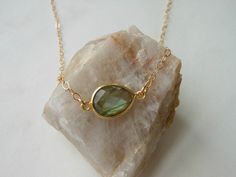 Give your girls a gift they'll enjoy and treasure for years to come. A beautiful pear shaped bezel set natural Labradorite stone with sparkling gold fill chain. Gorgeous flashes of blues and greens. Solid lobster clasp. Entire necklace is crafted in Gold Fill not plated so it will never chip, peel or flake. Labradorite is a strong gemstone of protection and spirit. It protects you from negative energies. All jewelry includes complimentary gift packaging. Every piece of jewelry is lovingly handcr Pear-shaped Necklace With Bezel Setting For Gift, Pear-shaped Bezel Setting Necklace For Gift, Teardrop Bezel Set Necklace Gift, Gift Jewelry Teardrop Pendant With Bezel Setting, Gift Teardrop Pendant Jewelry With Bezel Setting, Gift Jewelry With Bezel Setting In Teardrop Pendant Shape, Teardrop Pendant Jewelry With Bezel Setting, Green Pear Shaped Necklace For Gift, Green Pear Shaped Necklace Gift