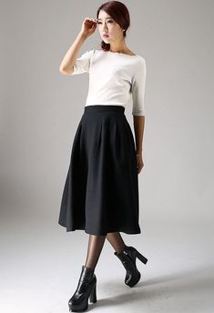 pleated A line wool Skirt in Black 1087# – XiaoLizi Elegant Black A-line Skirt, Chic A-line Wool Bottoms, Classic A-line Pleated Skirt For Fall, Chic Wool A-line Skirt, Elegant A-line Bottoms For Winter, Classic Fitted A-line Skirt, Elegant Flared Skirt For Fall, Fall Evening Pleated Skirt With Relaxed Fit, Elegant Fall Skirt For Workwear