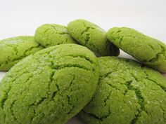 green cookies are stacked on top of each other