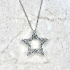 A lovely vintage natural diamond star pendant crafted in 14 karat yellow gold. It is pavé-set with 29 natural diamonds weighing approximately 1/3 carat. The diamonds are approximately G-H color, SI clarity. It comes with an 18-inch 14 karat white gold rope chain. The chain is 0.80 mm thick. Stamped 14KT. The pendant is stamped 14K. W: 0.78 inch / 1.99 cm. Weighs 2.41 grams. Birthstone: April. Condition: Very good. Minor wear throughout metal. A spot is a bit yellowish due to rhodium fading on the side (not visible face-up). Note: This item has been appraised and inspected by a jewelry specialist and certified gemologist (GIA GG). All diamond and gemstone gradings are done under GIA standards as the mounting and setting permit. All gemstone weights and item measurements are approximate. All Star Necklaces, Gold Star Necklace, Smoky Quartz Jewelry, Gemstone Rings Vintage, Vintage Inspired Rings, Star Necklace Gold, Gold Rope Chains, Jewelry Appraisal, Star Pendant Necklace