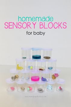 a stack of plastic cups filled with different types of baby items and text that reads homemade sensory blocks for baby