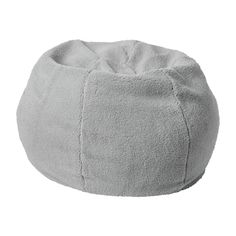 a grey bean bag sitting on top of a white floor