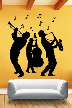 the silhouettes of three men playing musical instruments