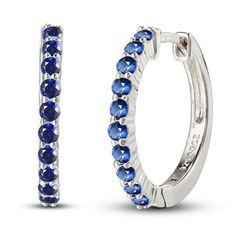 Vivid round blue lab-created sapphires shimmer along these dainty hoop earrings crafted in classic sterling silver. The earrings measure 18.6mm and secure with hinged backs. Blue Hoop Earrings, Dainty Hoop Earrings, Silver Prices, Earring Crafts, Sapphire Earrings, Sapphire Stone, White Earrings, Accessories Jewelry Earrings, Earrings Sterling Silver