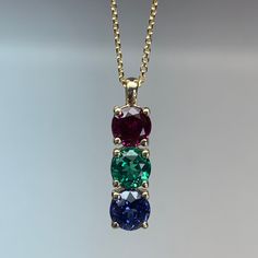 "The pendant pictured is lab created sapphire #7119 This necklace can be made with any color birthstone Please Contact us before you purchase to make sure we have the desired birthstones available. Changing stone colors may change the price of the necklace Please message us before purchasing if you would like to change stone colors. -Approximate total carat weight: approx. 1.50ctw diamond equivalent -Center Stone Size: 5mm - approx. .50ct each diamond equivalent -Center Stone Shape: 3 round -Gem Multi Stone Jewellery, Two Stone Pendant Design, 3 Stone Pendant, 18kt Gold Jewelry, Gem Stone Pendant, Gem Stone Necklace, Gold Birthstone Necklace, Diamond Pendant Jewelry, Small Pendants