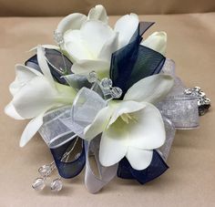 a bridal bouquet with white and blue flowers