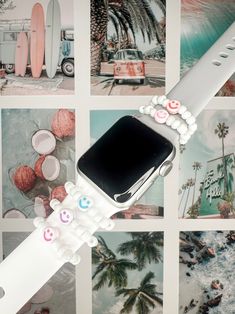 an apple watch is decorated with stickers on the band and has pictures of surfboards behind it