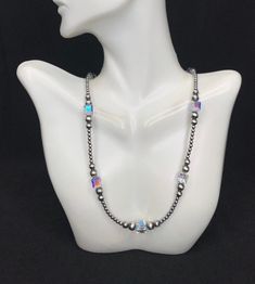 This is a high quality handmade Navajo Pearl silver bead necklace with Crystal. The silver beads are 3,5,6mm and the Crystal are 8mm. Necklace measures 18" long.  Necklace is handmade in USA and of Southwest origin. Thanks for looking and check out more items in my Etsy shop for more great items and deals! https://www.etsy.com/shop/925usa Payment: We accept all major credit cards through direct check out and Paypal. New Mexico residents have to pay sales tax. Payments must be made within 3 days Silver Spiritual Necklaces With 8mm Beads, Silver Spiritual Necklace With 8mm Beads, Sterling Silver Beaded Necklace With Spacer Beads, Classic Silver Necklace With Spacer Beads, Classic Silver Beaded Necklace With 8mm Beads, Sterling Silver Single Strand Beaded Necklace, Silver Necklaces With 8mm Beads For Jewelry Making, Handmade Silver Beaded Necklaces With Oval Beads, Silver Adjustable Beaded Necklace With Polished Beads