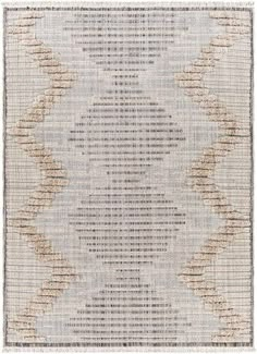 a rug with an abstract design on the front and back of it, in beige