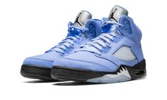 The Air Jordan 5 “UNC” is a colorway of the retro basketball shoe in a colorway inspired by Michael Jordan’s alma mater, the University of North Carolina.  The “UNC” Jordan 5 is not affiliated with the UNC Tar Heels, but nonetheless draws inspiration from the school and its college basketball team.  The upper is designed in a University Blue nubuck construction with translucent netting on the tongue and mid-panel.  A Jumpman is embroidered on the reflective Metallic Silver tongue.  The heel is u Jordan 5 Unc, Tenis Jordan, Unc University, Nike Air Jordan 5, Jordan Sneaker, Blue Jordans, Jordan Model, Jordan 5 Retro, Baskets Nike