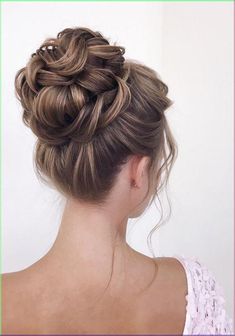 High bun hairstyles are always a popular choice for brides because of their classic look that has stood the test of time! You can create a messy top knot bridal bun for a more romantic or bohemian look to go with a bohemian wedding, or create a sleek and sophisticated style for a more elegant