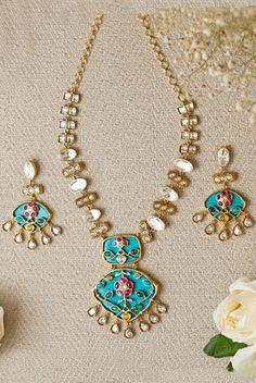 Blue Polki Necklace and Earrings Zevar by Geeta - Fabilicious Fashion Elegant Turquoise Kundan Necklace For Festive Occasions, Elegant Turquoise Kundan Necklace, Traditional Blue Jewelry Sets For Reception, Festive Turquoise Jewelry For Party, Blue Kundan Necklace For Reception, Blue Kundan Necklace With Intricate Design For Festive Occasions, Festive Blue Kundan Necklace With Cutdana, Blue Kundan Necklace For Reception Festivities, Festive Blue Kundan Necklace With Intricate Design