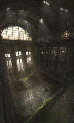 the interior of an abandoned building with lots of windows and plants growing on the floor