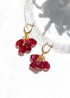 Gold Plated Pomegranate Dangle Earrings - Murano Lampwork Bead, Minimalist Seed Jewelry, Elegant Fruit Inspired Accessories Check out our jewelry selection for unique and custom handmade items from CharmLuckyByPelin. PRODUCT FEATURES; → Gold plated brass, murano glass beaded earrings. → Earring color: Gold, Red, Pink → It's dainty and it can be worn daily. 🎁 Our gift of a luck bracelet with evil eye beads is shipped with your order. ✿ Find more to here: https://www.etsy.com/shop/CharmLuckyByPel Briolette Dangling Beads Earrings Gift, Gift Briolette Earrings With Dangling Beads, Seed Jewelry, Fruit Jewelry, Shiny Objects, Fruit Earrings, Jewelry Elegant, Nose Jewelry, Murano Glass Beads