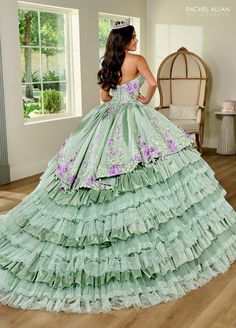 Meet the epitome of grace, elegance, and tradition! Our meticulous taffeta ballgown is a dream come true for every Quinceañera. Featuring captivating lace detail, dazzling appliqué and beading, and detachable tulle sleeves, this dress is a true masterpiece. Fabric: Taffeta, Lace, Beaded, Applique Length: Full Length Sleeve Style: Strapless with Detachable Sleeve Color: Black Multi, Sage Multi, White Multi Sizes: 0, 2, 4, 6, 8, 10, 12, 14, 16, 18, 20, 20W, 22W, 24W, 26W, 28W, 30W Occasion: Quince Floral Ballgown, Red Quinceanera Dresses, Black Ball Gown, Tulle Sleeves, Dresses Quinceanera, Rachel Allan, Dress Guide, Sweet 16 Dresses, Beaded Applique