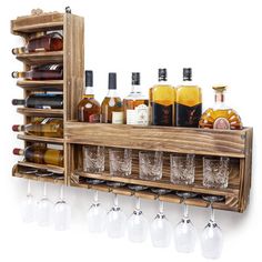 a wooden shelf filled with lots of bottles and glasses