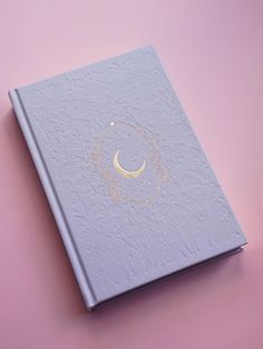 This journal is more than just a planner--it's a tool designed to help you cultivate mindfulness, build positive habits, and nurture your personal growth. By following the lunar cycles, you'll learn to align with the natural ebb and flow of energy. Whether you're new to journaling or a seasoned writer, this planner is here to inspire and support you on every step of your journey. The Moon has been a source of inspiration, mystery, and guidance for centuries, and now it's your turn to harness its Moon Date, Moon Journal, Habit Trackers, Holiday Offer, Ebb And Flow, Lunar Cycle, Dotted Page, Positive Habits, Time Design