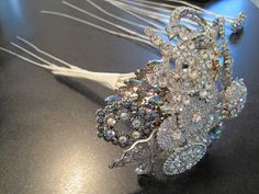 a close up of a brooch on a table