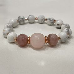 Stylish bracelet made out of white howlite, rose quartz and rose jade. 🌸⠀ ⠀ White Howlite is a calming stone, brings compassion and sensitivity to its wearer.⠀ ⠀ - soothes the body, mind, spirit ⠀ - helps balance calcium levels in the body⠀ - great for people who overreact or too emotional ⠀ - connects to the third-eye chakra⠀ All jewelry comes in premium packaging, gift ready, plus a stylish postcard All of our jewelry are designed and crafted by hand in our atelier in Bulgaria with careful at Adjustable White Rose Quartz Jewelry, Healing Rose Quartz Beaded Bracelets In Rose Gold, White Crystal Bracelet For Healing, White Rose Quartz Beaded Bracelets As Gift, White Rose Quartz Beaded Bracelet As Gift, White Rose Quartz Jewelry With 8mm Beads, Healing Rose Gold Rose Quartz Beaded Bracelet, White Rose Quartz Crystal Bracelet With Round Beads, White Rose Quartz Crystal Bracelet As A Gift