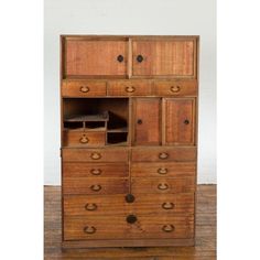 an old wooden dresser with many drawers