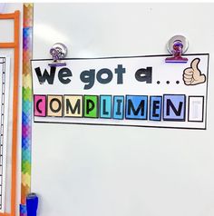 we got a compliment word made out of cut outs and magnets on a bulletin board