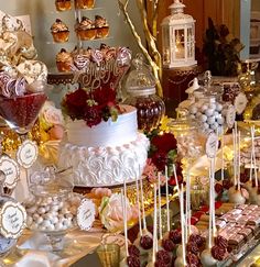 a table filled with lots of desserts and candies