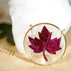 Our preserved Maple leaf necklace is the PERFECT way to embrace the fall season.This necklace is made with tiny leaves, cut from larger maple leaves. They are preserved in clear  bio-resin and set in a 30 mm silver or gold-plated frame. This fall beauty will come to you on either a 24k gold-fill chain or a sterling silver chain, you choose the length!Please keep in mind that each necklace will be a bit different! Each leaf may vary slightly in color or shape, due to the nature of "nature" and th Brown Leaf-shaped Jewelry For Gift, Red Nature-inspired Jewelry For Gifts, Handmade Jewelry For Fall Gift, Brown Jewelry Gift For Fall, Brown Jewelry For Fall Season Gift, Brown Jewelry For Fall Gifts, Red Pressed Flowers Round Jewelry, Red Round Jewelry With Pressed Flowers, Maple Leaf Necklace