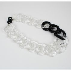 This is part of Chairish’s Costume Jewelry assortment.  This elegant Angela Caputi, made in Italy choker necklace features an extra-large flat resin chain design in trans[arent color with black contrast. Her matching of colors is always bold and classy. As you know, Caputi jewelry is not signed. This pre-owned necklace has had the plastic tag removed, but it still has the original brand signature tow-hooks closing clasp. Angela Caputi produced resin and Lucite jewelry collections since the 1980s Trendy Black Chain Link Necklace, Party Jewelry With Plastic Chain, Modern Black Chain Necklace For Party, Trendy Clear Jewelry With Chain, Black Chain Link Necklace For Party, Black Resin Party Jewelry, Trendy Black Glass Jewelry, Transparent Chain Necklace, Modern Black Jewelry With Chunky Chain