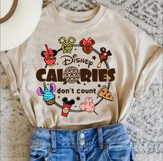 a t - shirt that says disney calories don't count on the front