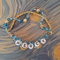 mine! made this for my friend <3 3 Friendship Bracelets, Percy Jackson Bracelet Pattern, Hamilton Bracelet Ideas, Walker Scobell Bracelet, Fun Bracelet Ideas, Percy Jackson Clay Bead Bracelet, Art Stuff To Buy, Percy Jackson Friendship Bracelet, Percy Jackson Gift Ideas